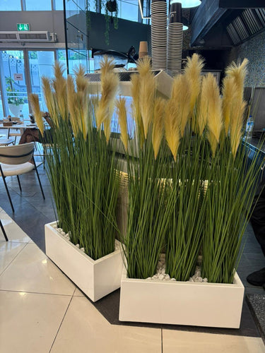 Artificial plant privacy plant in rectangle Plants UAE. Decorative potted plants in a modern indoor setting