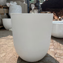 Long Lifetime Warranty Fiber Pot – Available in White, Yellow, Beige & Grey, UAE. Close-up of a white chair with a blurred background